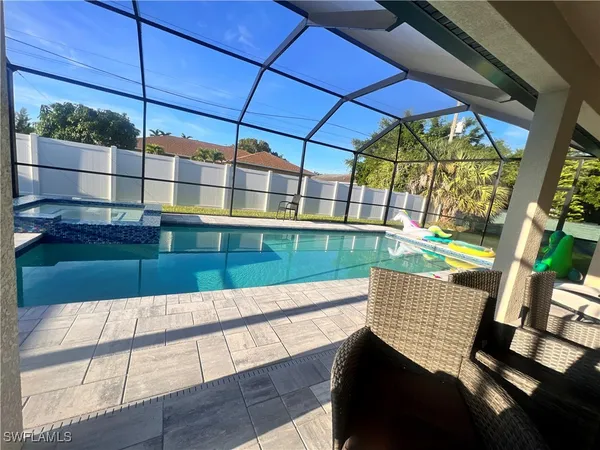 a view of a chairs and table in the patio