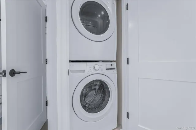 a kitchen with wooden floors white cabinets and stainless steel appliances