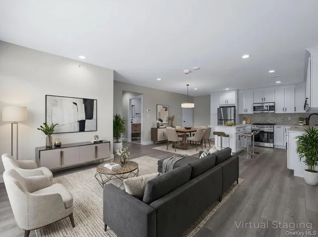 a living room with furniture and a rug
