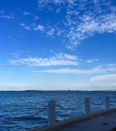 a view of a swimming pool with a table and chairs