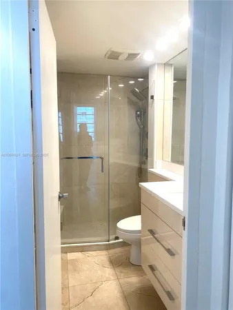 a living room with furniture a chandelier and a chandelier