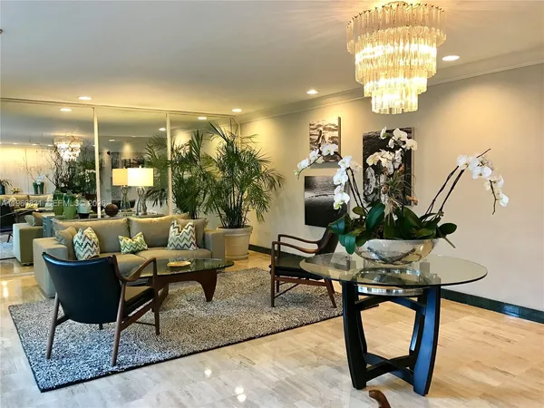 a living room with furniture and a pool table