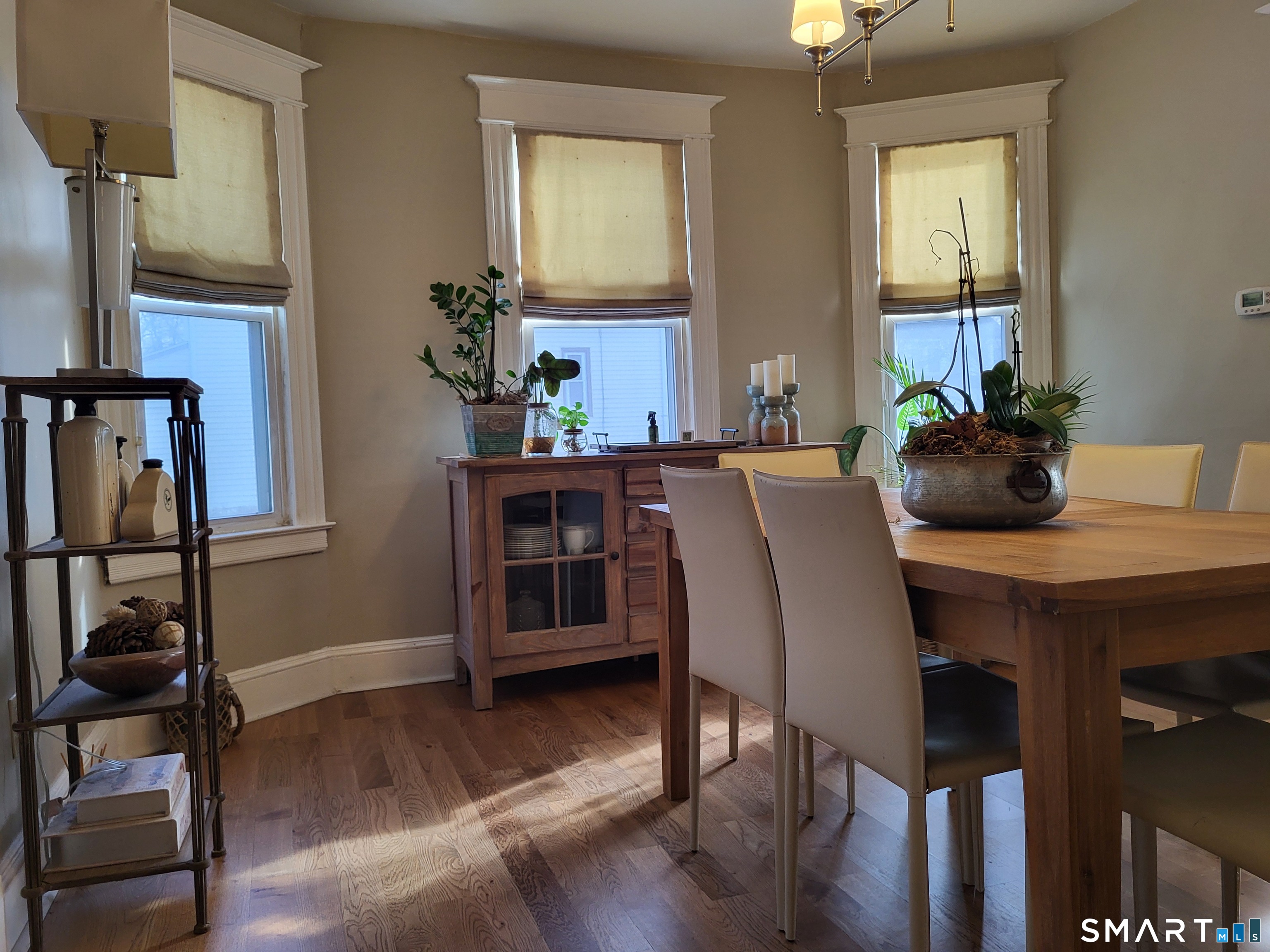 110 Darby Street Bloomfield, CT 06002 - Photo 12 of 39 a dining room with furniture and wooden floor