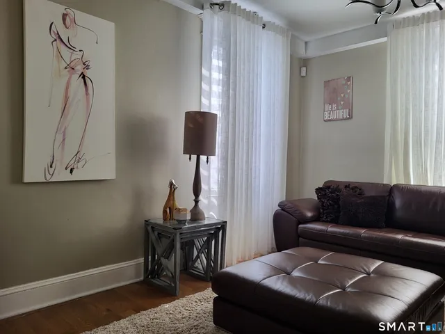 a backyard of a house with fire pit and chairs