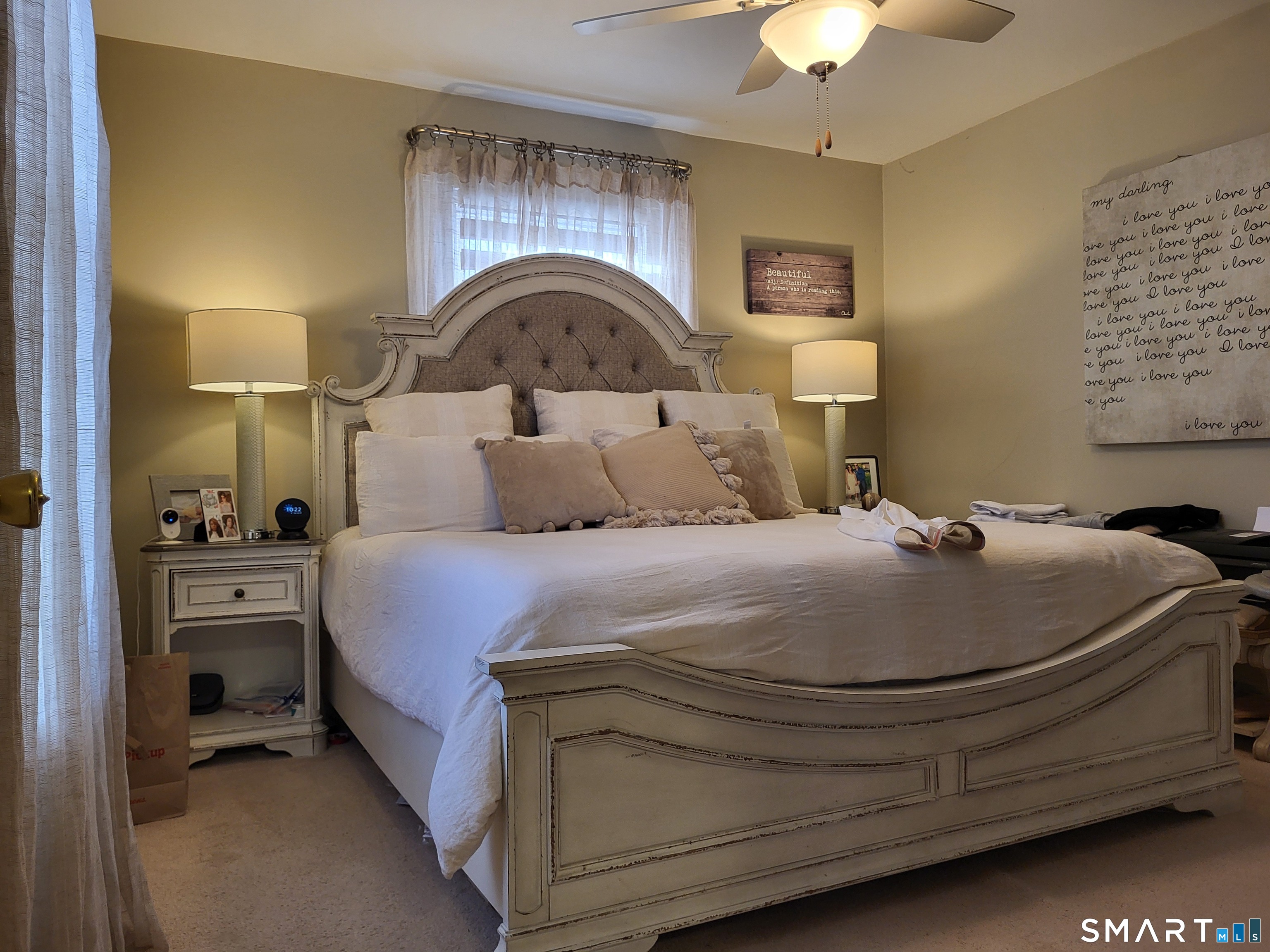 110 Darby Street Bloomfield, CT 06002 - Photo 20 of 39 a bedroom with a bed and a chandelier