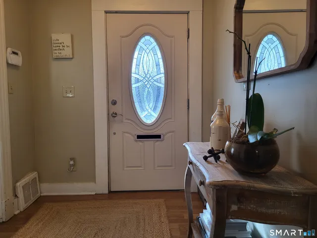 a kitchen with stainless steel appliances granite countertop a refrigerator and a stove