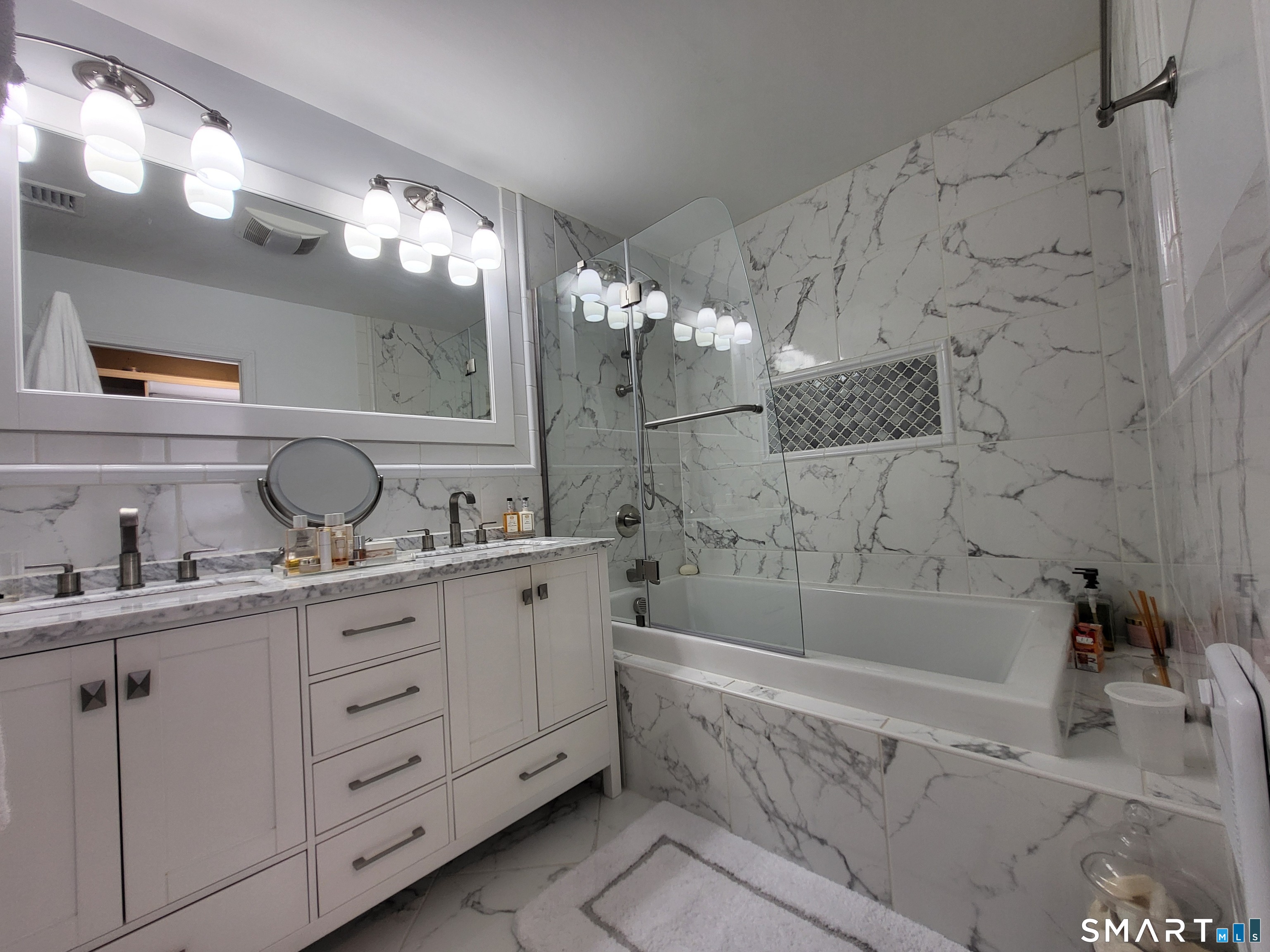 110 Darby Street Bloomfield, CT 06002 - Photo 21 of 39 a bathroom with a sink double vanity granite tub shower and a mirror