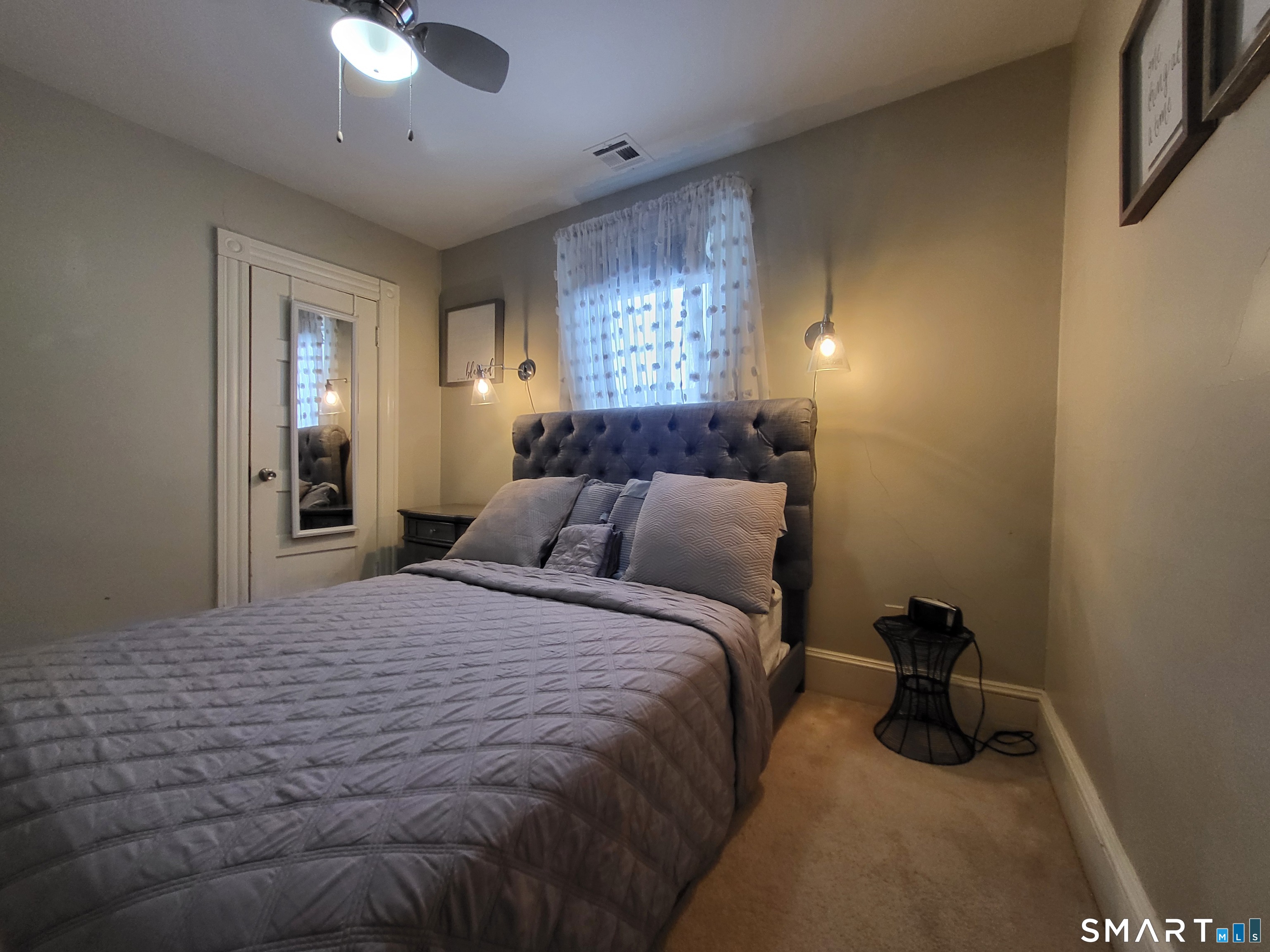 110 Darby Street Bloomfield, CT 06002 - Photo 25 of 39 a bedroom with a bed and a lamp