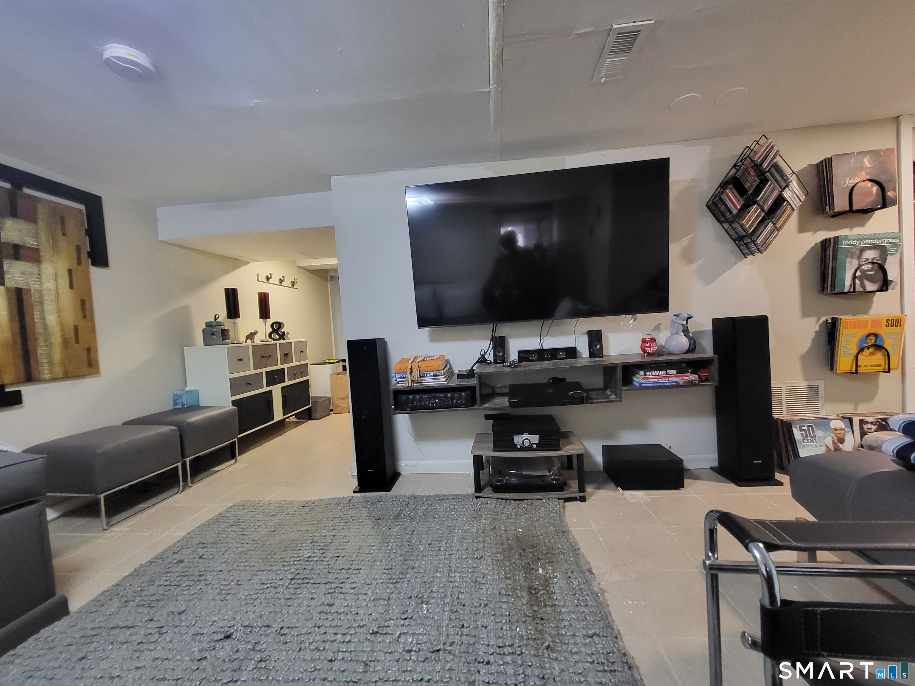 110 Darby Street Bloomfield, CT 06002 - Photo 28 of 39 a living room with furniture and a flat screen tv