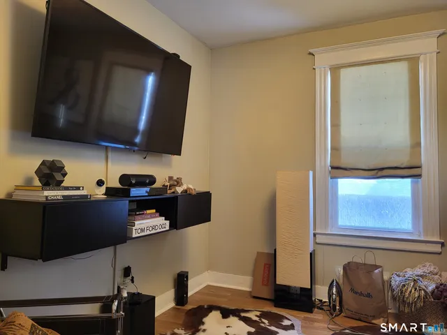 a bedroom with a bed and a lamp