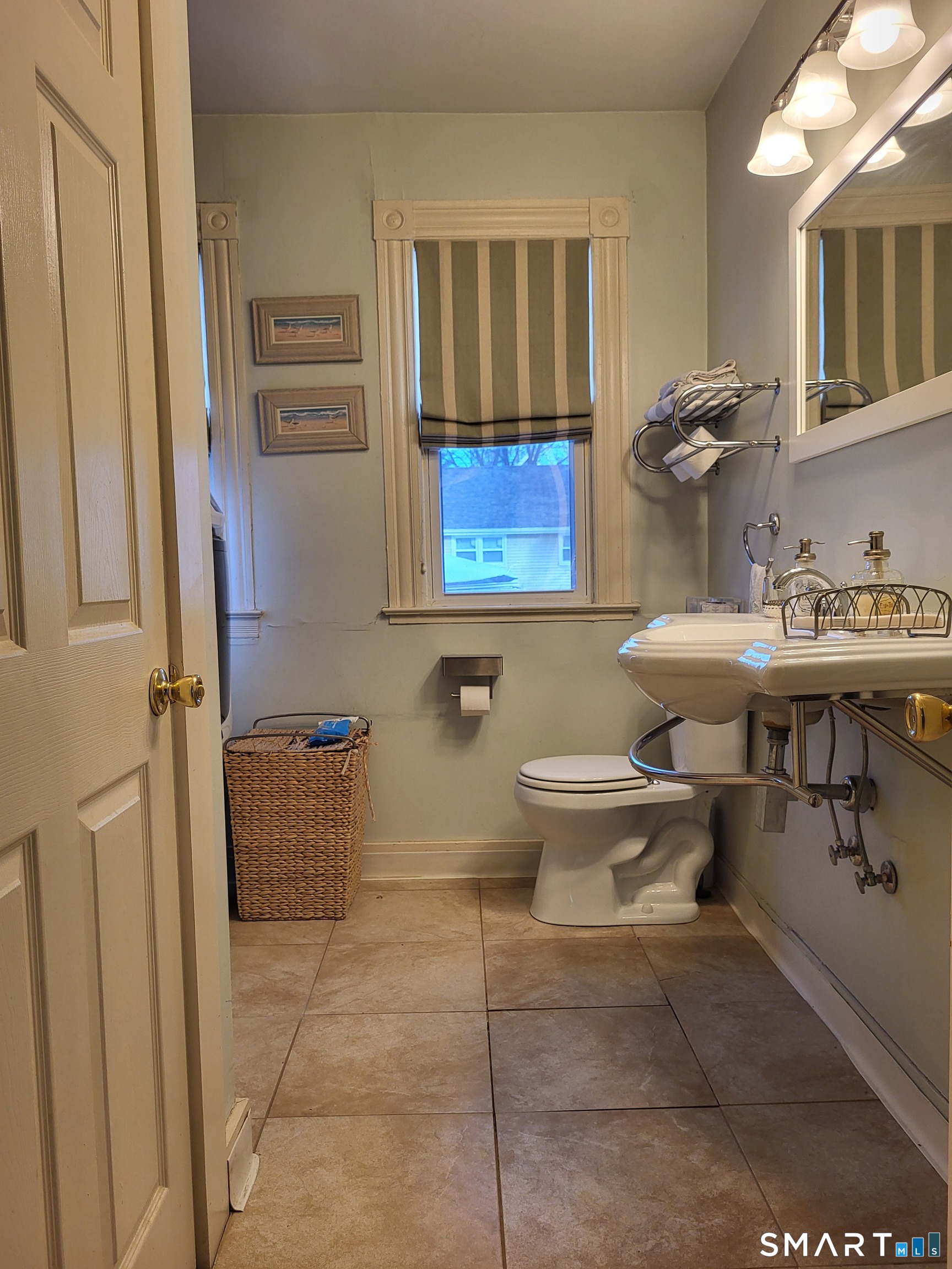 110 Darby Street Bloomfield, CT 06002 - Photo 9 of 39 a bathroom with a toilet sink and mirror