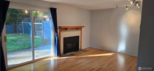 a view of hallway with wooden floor and front door