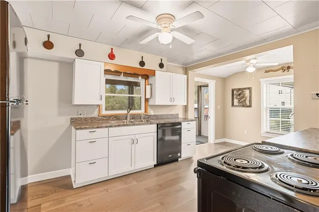 a kitchen with stainless steel appliances granite countertop a stove and a refrigerator