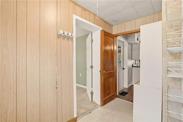 a bathroom with a shower and a glass door