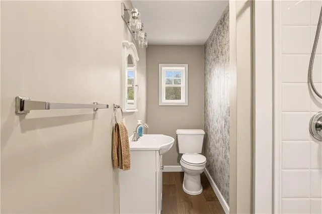 a bathroom with a toilet sink and tub