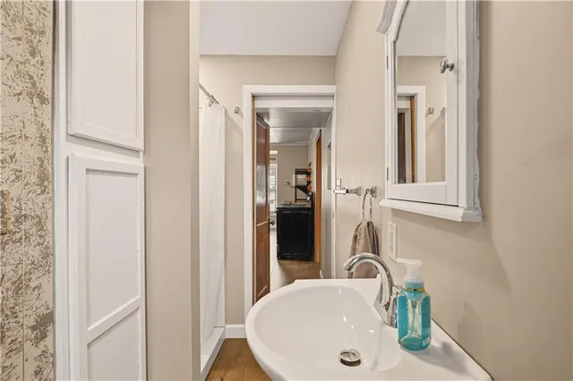 a bathroom with a sink and a mirror