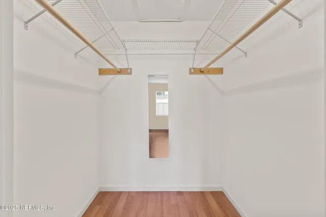 a view of walk in closet with window
