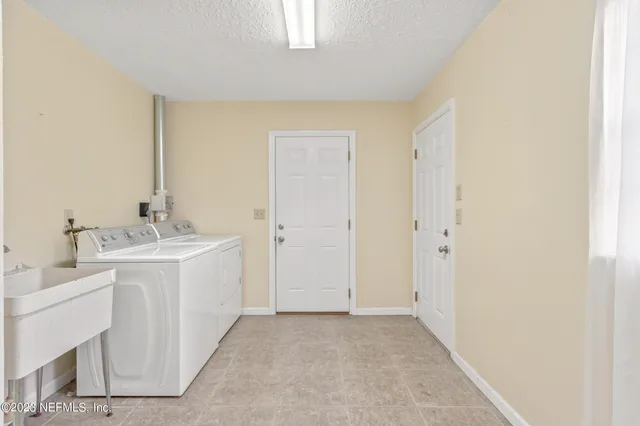 a bathroom with a sink a mirror and a bathtub