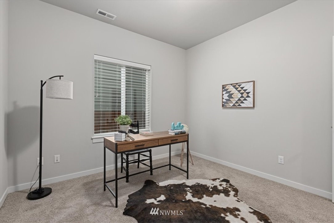 26 157th Lane Southeast Bothell, WA 98012 - Photo 16 of 37 a room with furniture and a window