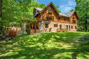 Welcome to Chateau Chappaqua, a chalet-style 4-bedroom Colonial which lives like a 6-bedroom residence with two main floor den/office suites, renovated from top to bottom, and set on 7 private acres.