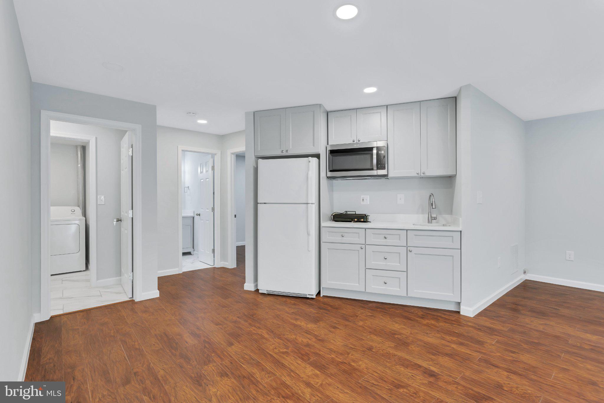 9009 Sweet Birch Court Springfield, VA 22152 - Photo 28 of 34 Modern kitchen with warm wood floors.