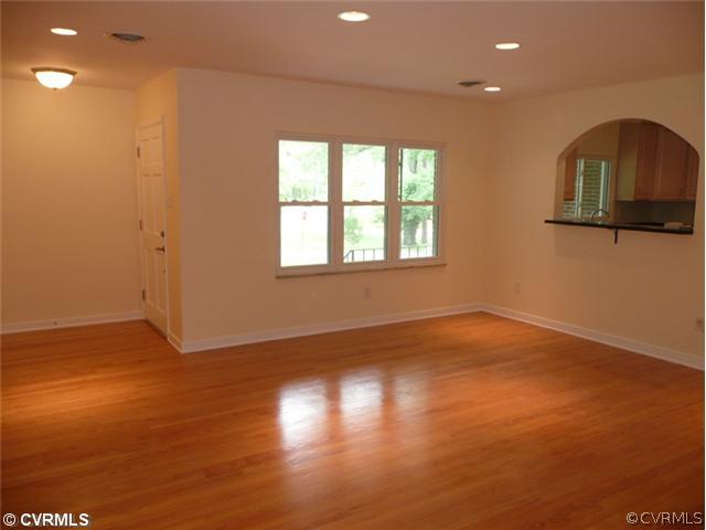 8127 Lethbridge Road Richmond, VA 23235 - Photo 3 of 12 Living Room - This living room says WOW! Beautiful, newly refinished Hardwood Floors, New Thermal Windows, Pass-Thru Bar to the Stunning Kitchen and so Much More. You will Love the Bright Open Floor Plan!