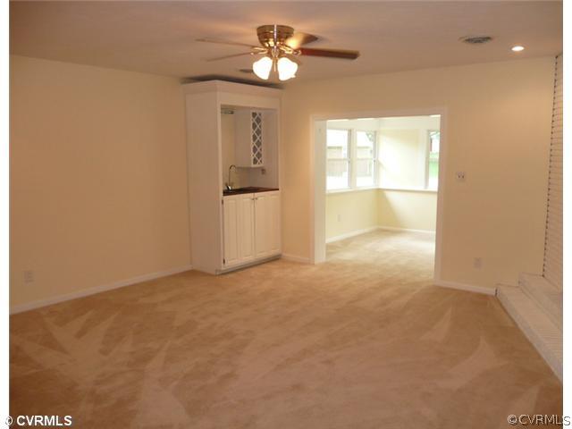8127 Lethbridge Road Richmond, VA 23235 - Photo 4 of 12 Den/Family/Great Room - This Room is Great For Entertaining. Step Down into This Huge Space. It Features a Built-in Wet Bar, Dynamic Brick Hearth Fireplace, Ceiling Fan and Recessed Lights. New Carpet, New Paint, and Access to the Sunroom .