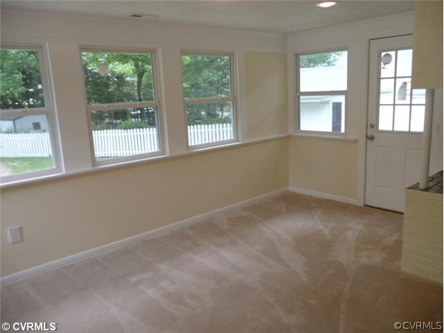 8127 Lethbridge Road Richmond, VA 23235 - Photo 8 of 12 Other - This Sunroom Offers A Relaxing View of the Expansive, Park-like Backyard. New Thermal Windows, New Carpet, New Paint and Recessed Lighting AND a cozy Fireplace That Make This Home a Treasure. Enjoy your Coffee While Relaxing in Your Sunroom.