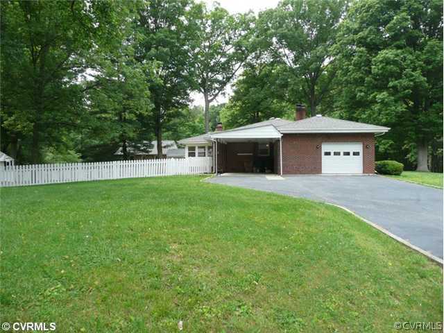 8127 Lethbridge Road Richmond, VA 23235 - Photo 9 of 12 Yard/Garden - This is a Great Lot Offers Access to the Carport and Garage as well as Your Picket Fenced Rear Yard. Welcome Home! Notice the Oversized Garage and Large Double Width Driveway. This House is Someone's Dream Home!