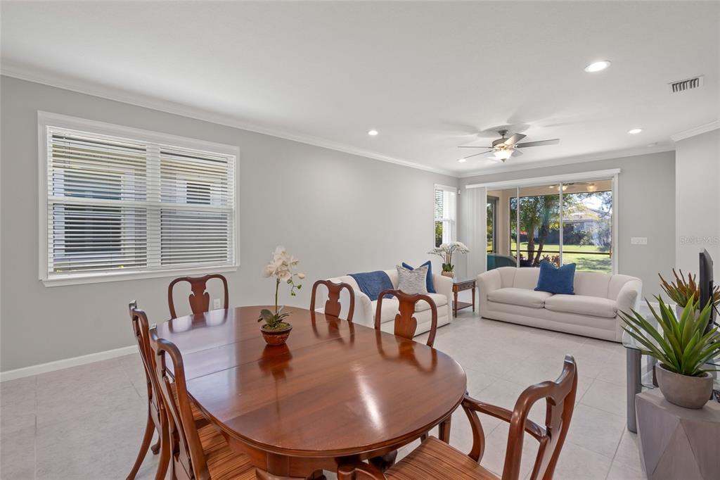 8605 Rain Song Road Sarasota, FL 34238 - Photo 11 of 52 a view of a dining room with furniture and window