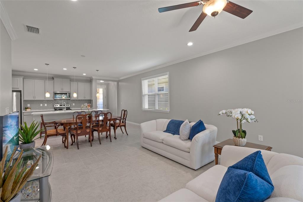 8605 Rain Song Road Sarasota, FL 34238 - Photo 14 of 52 a living room with furniture and a table