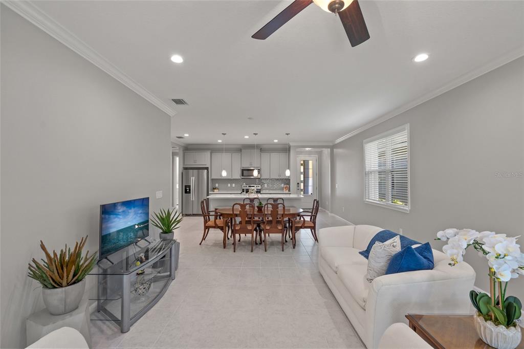 8605 Rain Song Road Sarasota, FL 34238 - Photo 16 of 52 a living room with furniture and a potted plant
