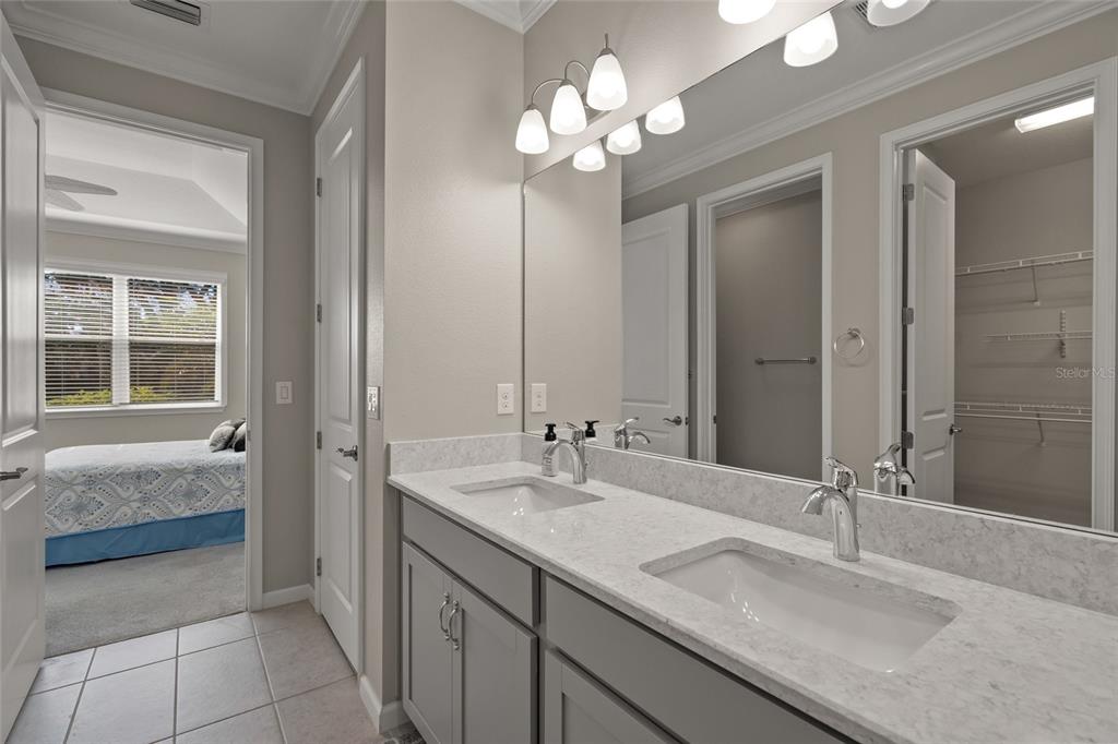 8605 Rain Song Road Sarasota, FL 34238 - Photo 21 of 52 a bathroom with a sink a vanity and a mirror