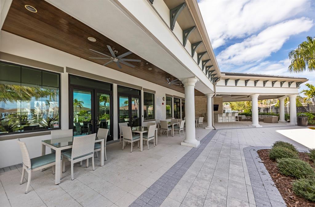 8605 Rain Song Road Sarasota, FL 34238 - Photo 41 of 52 a view of a patio with table and chairs