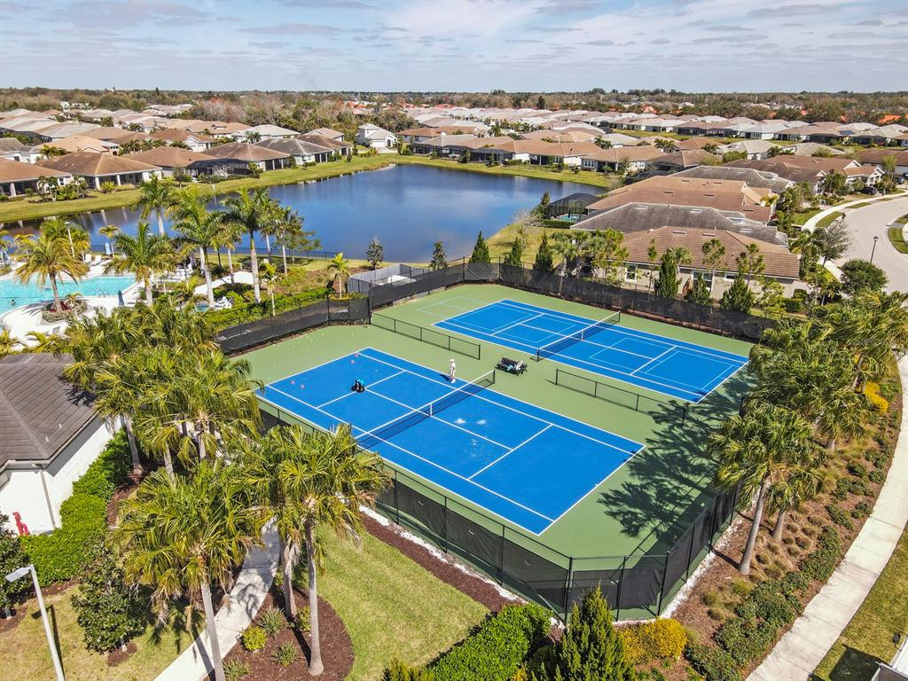 8605 Rain Song Road Sarasota, FL 34238 - Photo 49 of 52 an aerial view of a pool a yard and mountain view