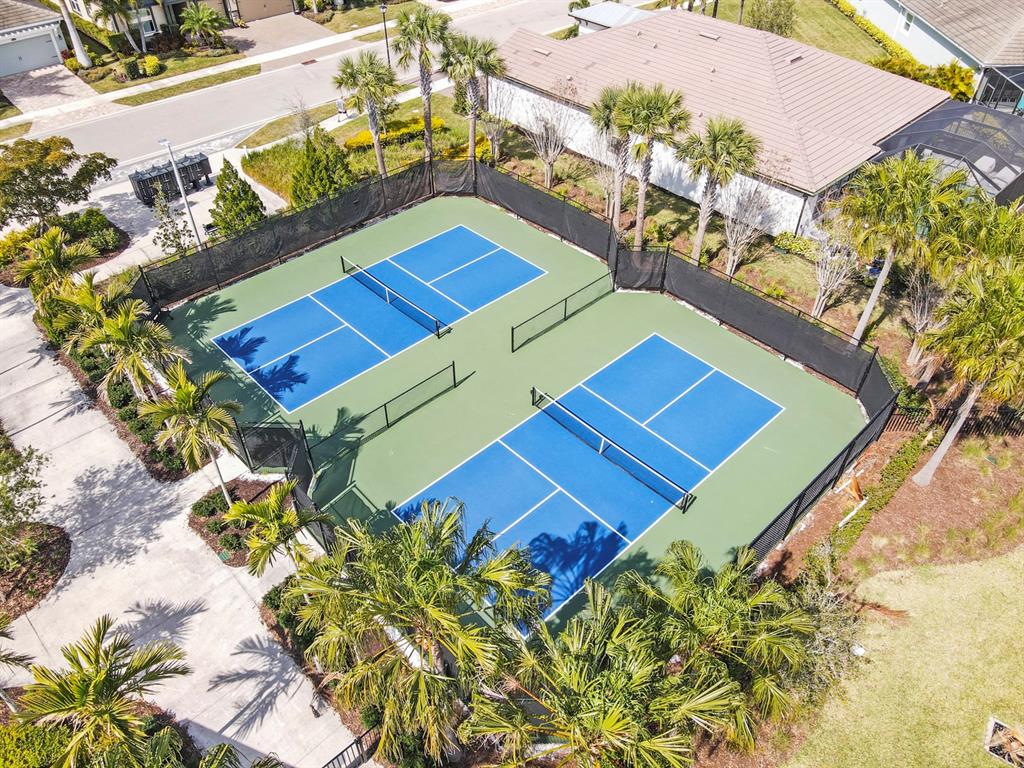 8605 Rain Song Road Sarasota, FL 34238 - Photo 50 of 52 view with a book and a bed