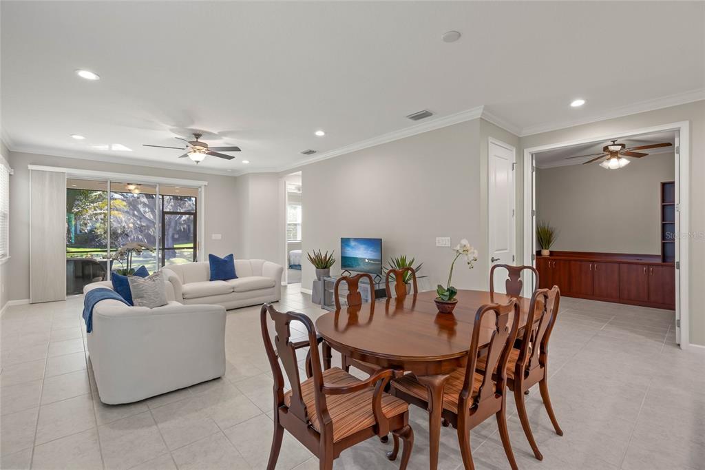 8605 Rain Song Road Sarasota, FL 34238 - Photo 9 of 52 a view of a dining room with furniture