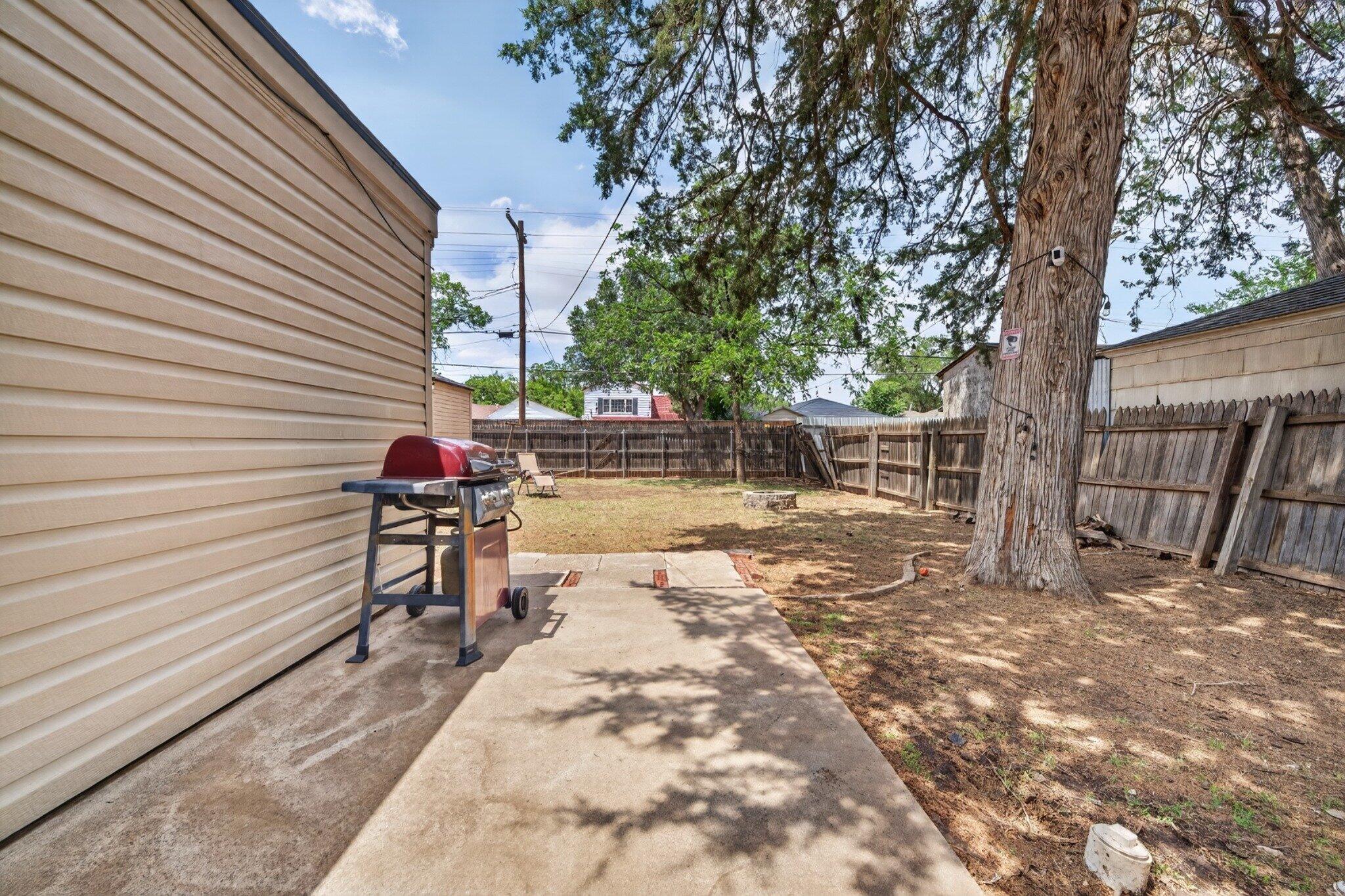 2212 22nd Street Lubbock, TX 79411 - Photo 13 of 14 a view of a bench in a backyard