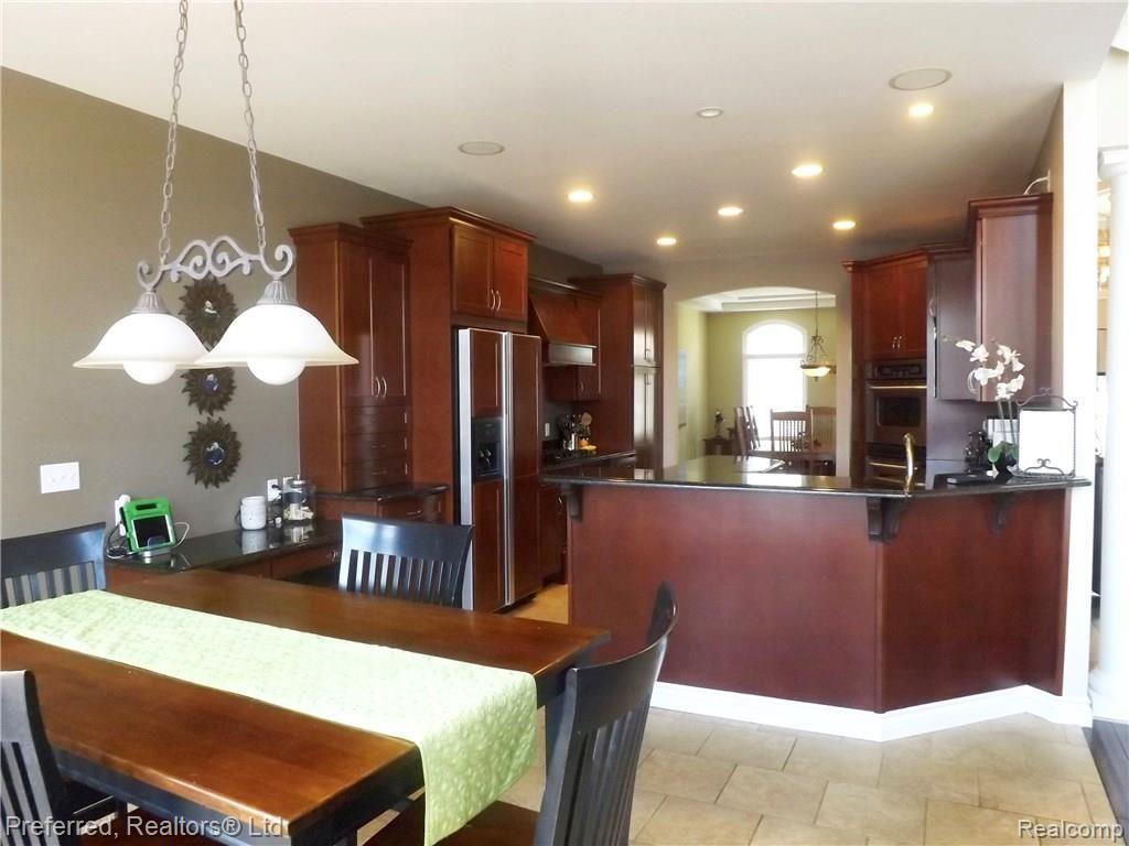 147 West Reed Lk Court Commerce Township, MI 48382 - Photo 8 of 46 Gorgeous Custom Cherry Cabinets w/Granite Countertops