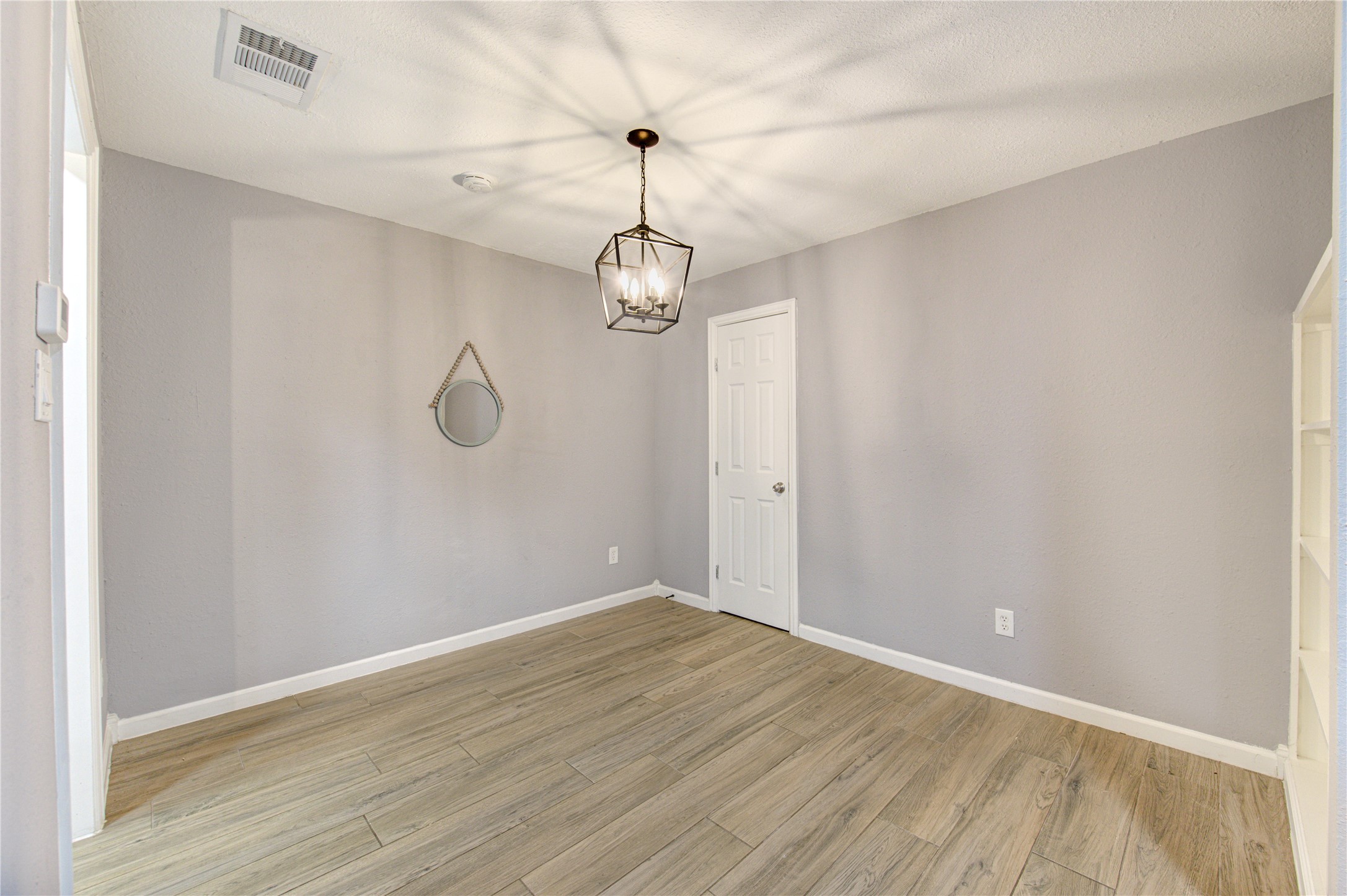 3929 Tanglewilde Street, Unit 3929 Houston, TX 77063 - Photo 20 of 44 a view of a room with wooden floor and windows