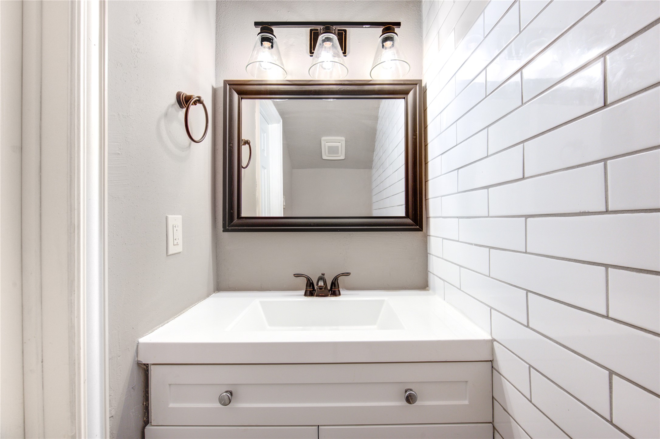 3929 Tanglewilde Street, Unit 3929 Houston, TX 77063 - Photo 24 of 44 a bathroom with a sink and a mirror