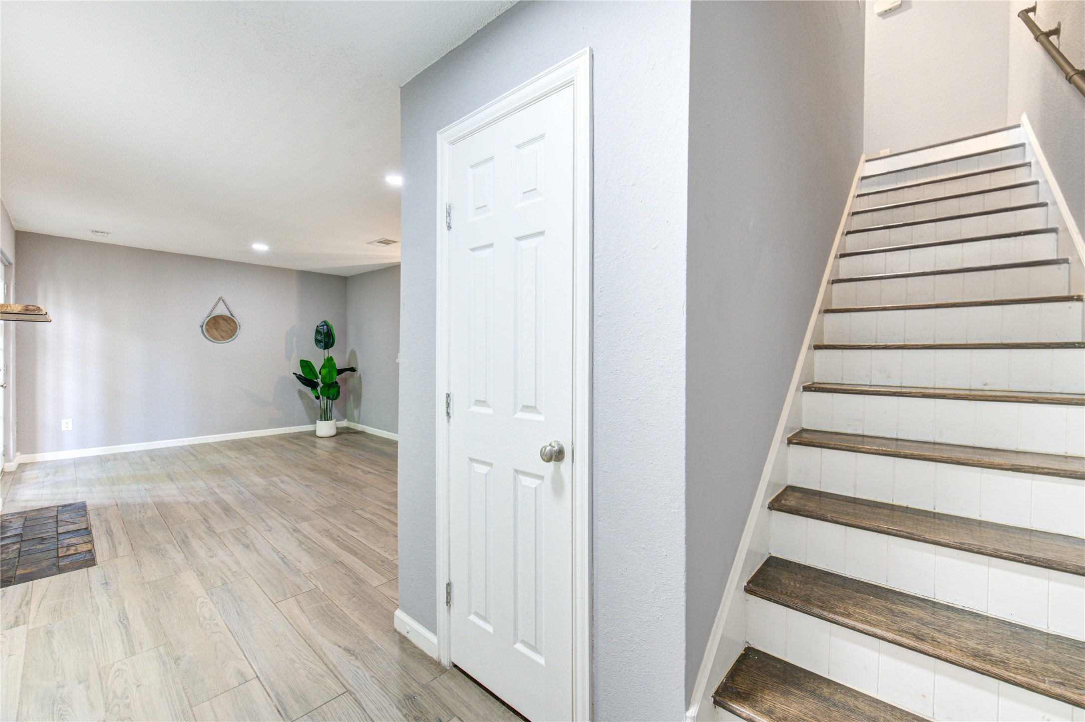 3929 Tanglewilde Street, Unit 3929 Houston, TX 77063 - Photo 26 of 44 a view of entryway with wooden floor and stairs