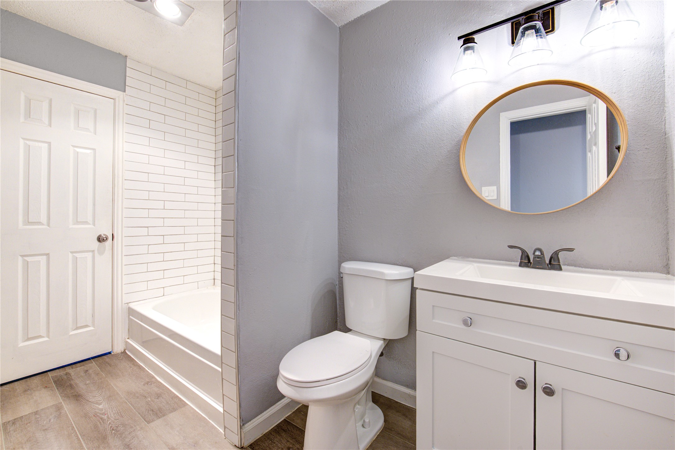 3929 Tanglewilde Street, Unit 3929 Houston, TX 77063 - Photo 36 of 44 a bathroom with a toilet sink and mirror