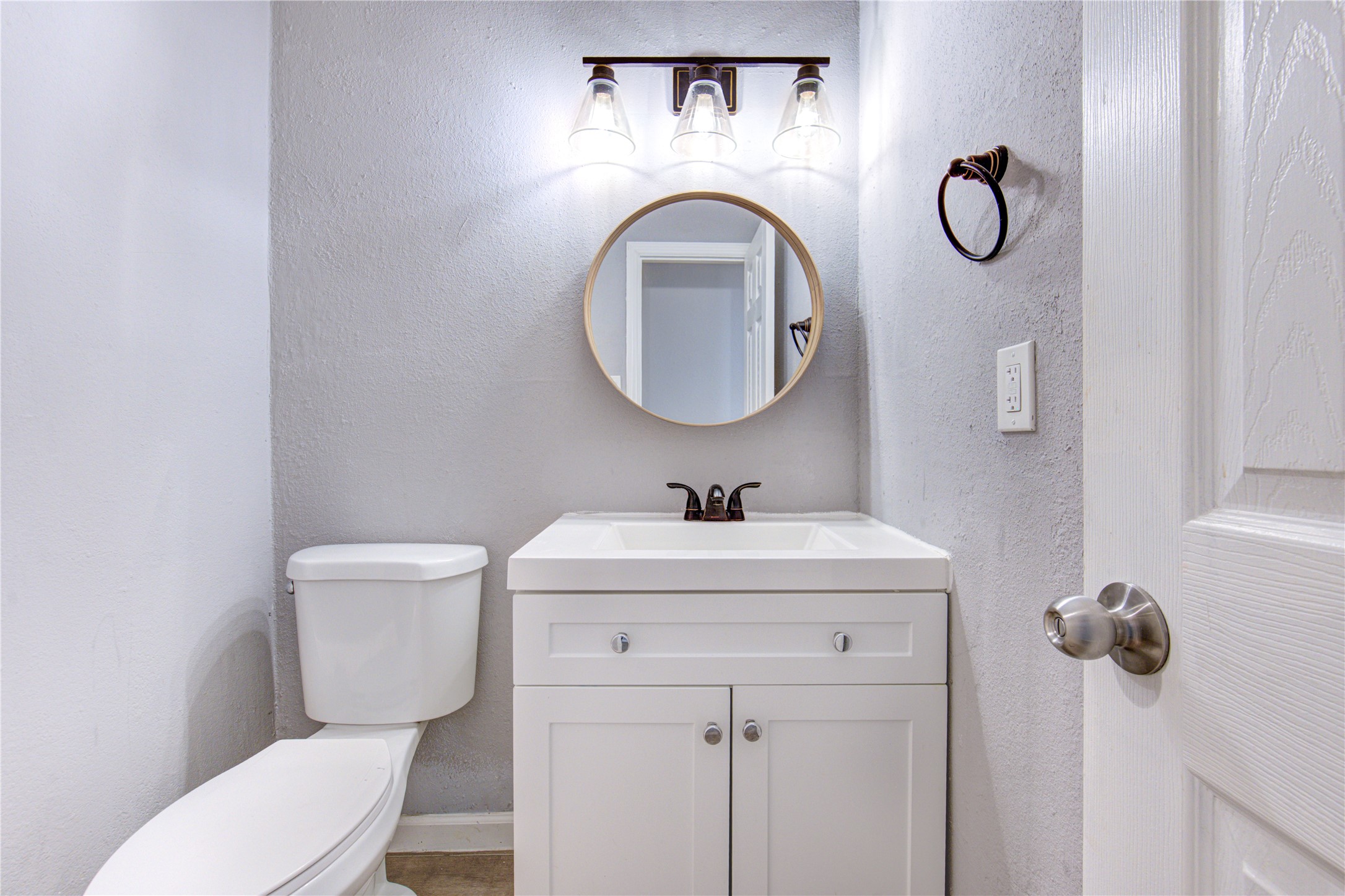 3929 Tanglewilde Street, Unit 3929 Houston, TX 77063 - Photo 37 of 44 a bathroom with a toilet sink vanity and mirror