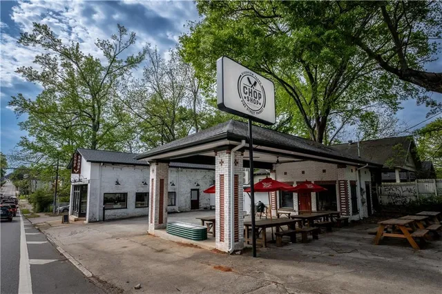 a view of a brick house with a large windows
