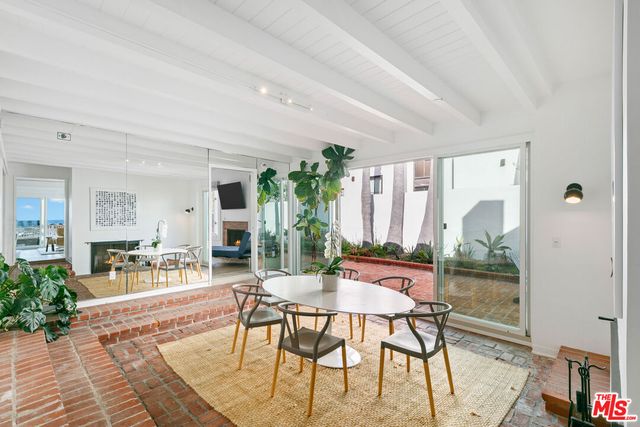 a bathroom with a shower sink and mirror