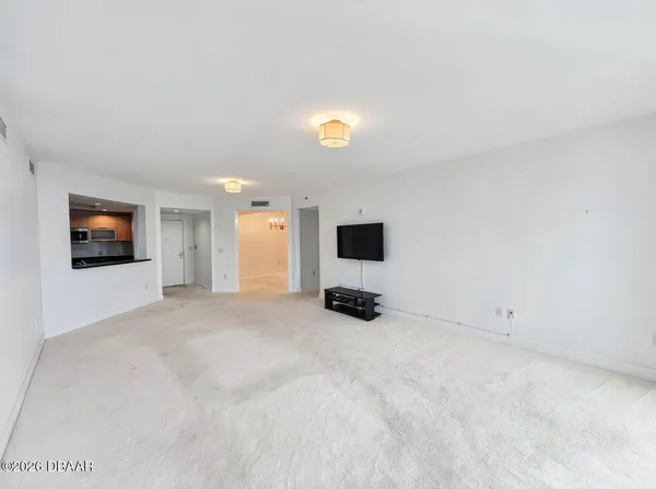 a view of a room with a flat screen tv