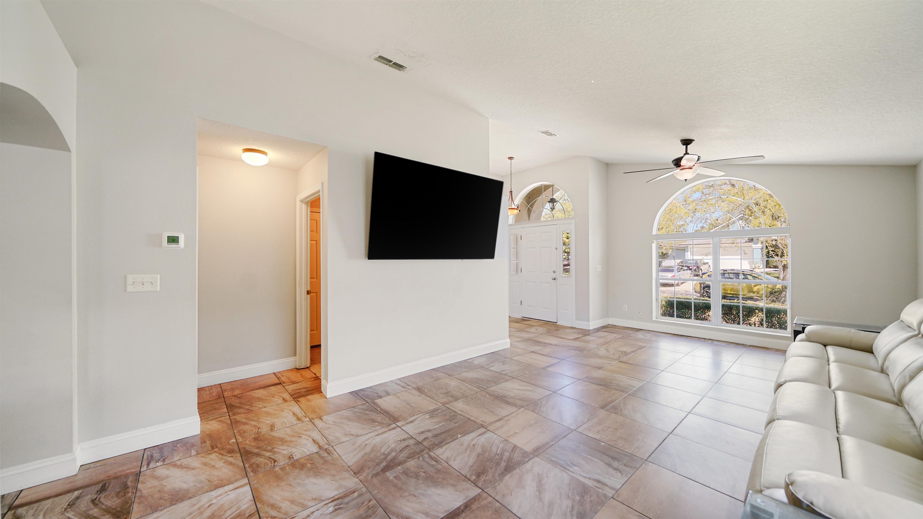 617 Birchbark Trail St. Augustine, FL 32092 - Photo 4 of 41 a view of a livingroom with a flat screen tv