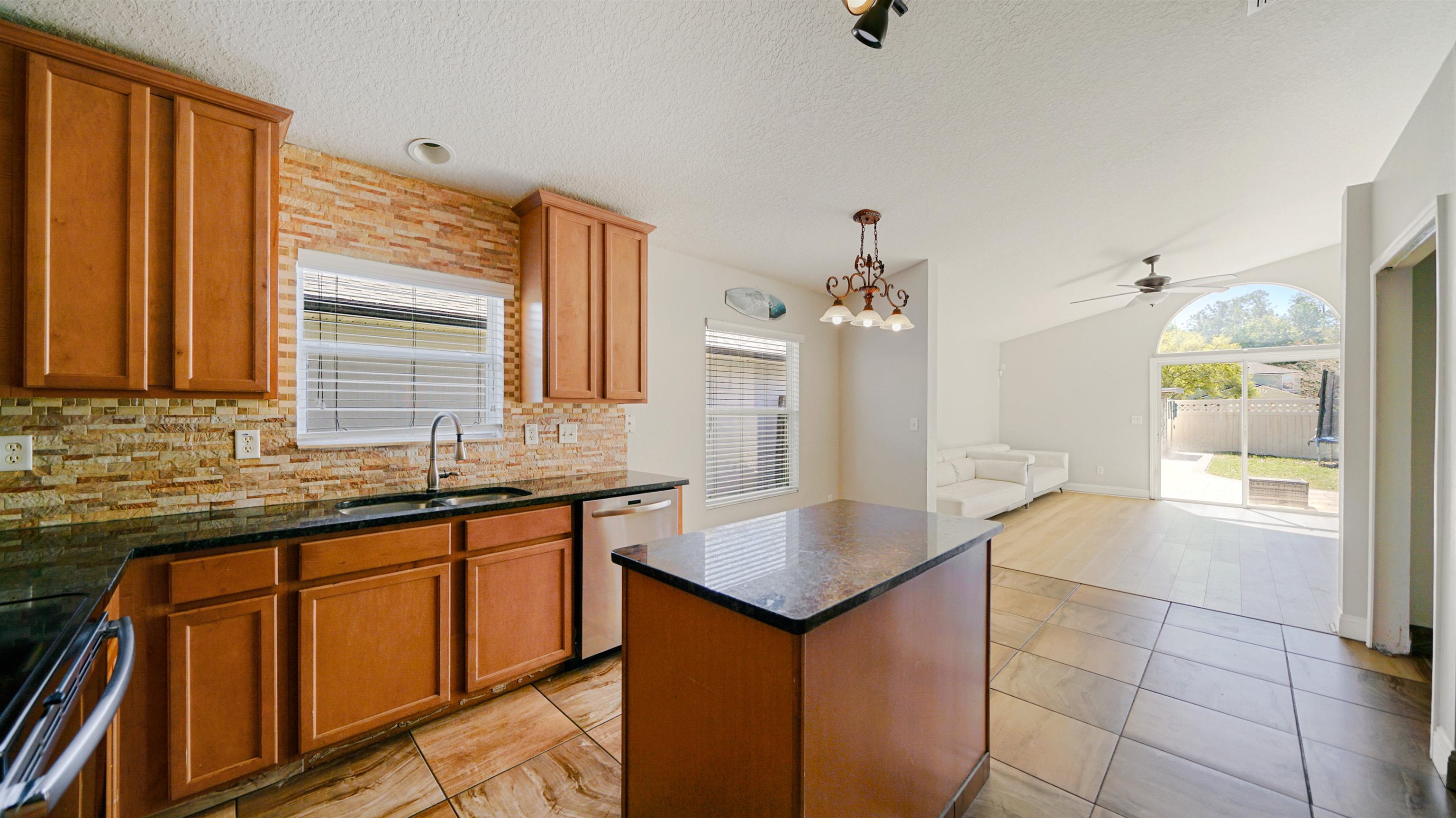 617 Birchbark Trail St. Augustine, FL 32092 - Photo 5 of 41 a bathroom with a granite countertop sink and a mirror
