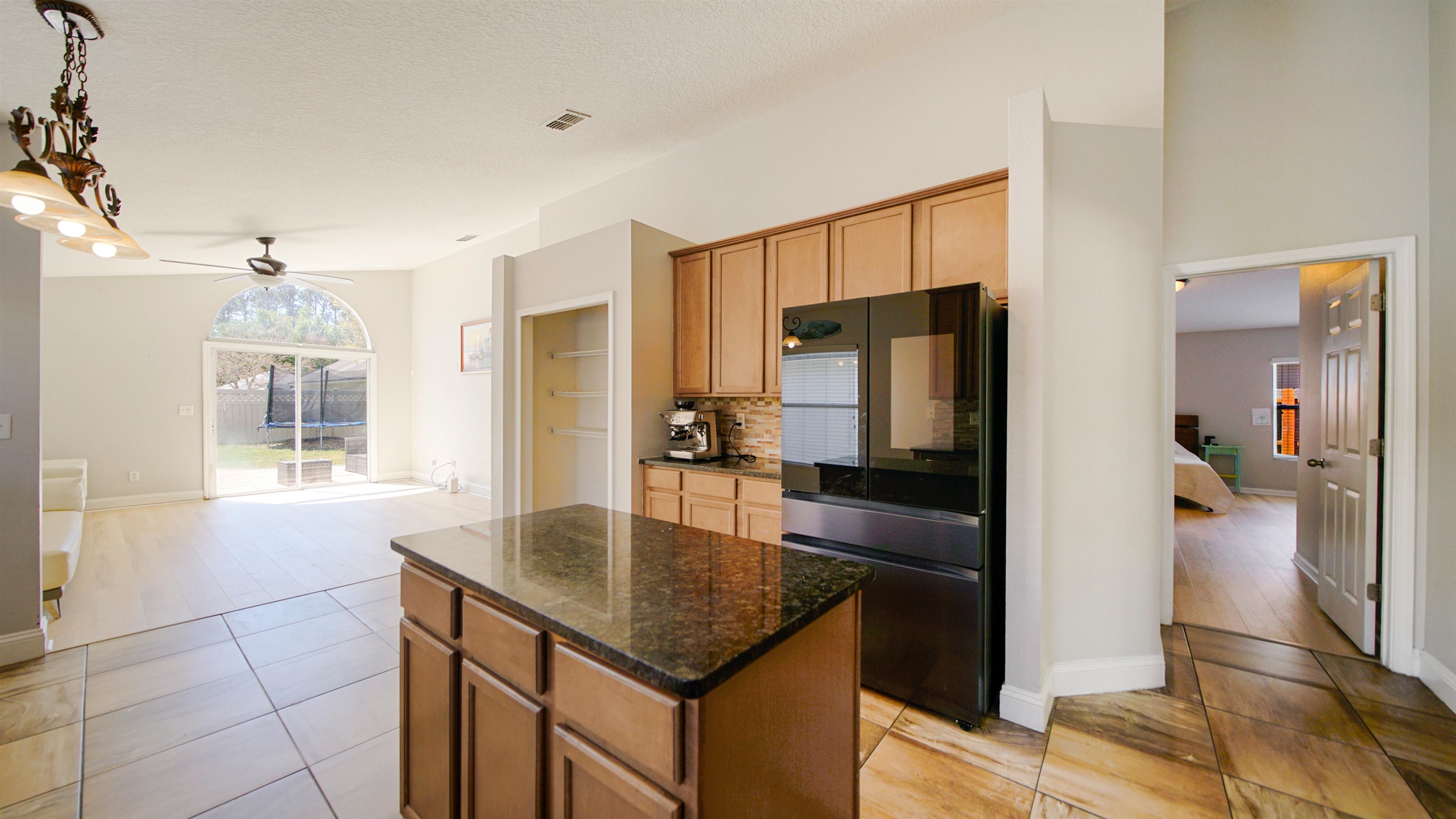 617 Birchbark Trail St. Augustine, FL 32092 - Photo 8 of 41 a kitchen with kitchen island a counter top space appliances and a window